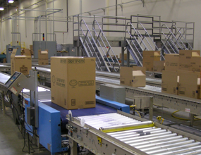 Complex packaging system showing check-weigh for bar-coded boxes and 18 lanes of sorting