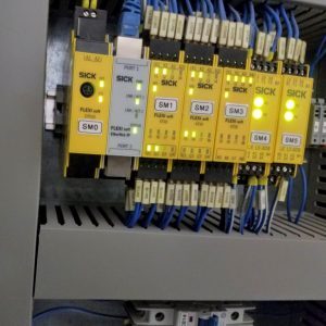 Using an external PLC to bridge communications between a robot and a machine